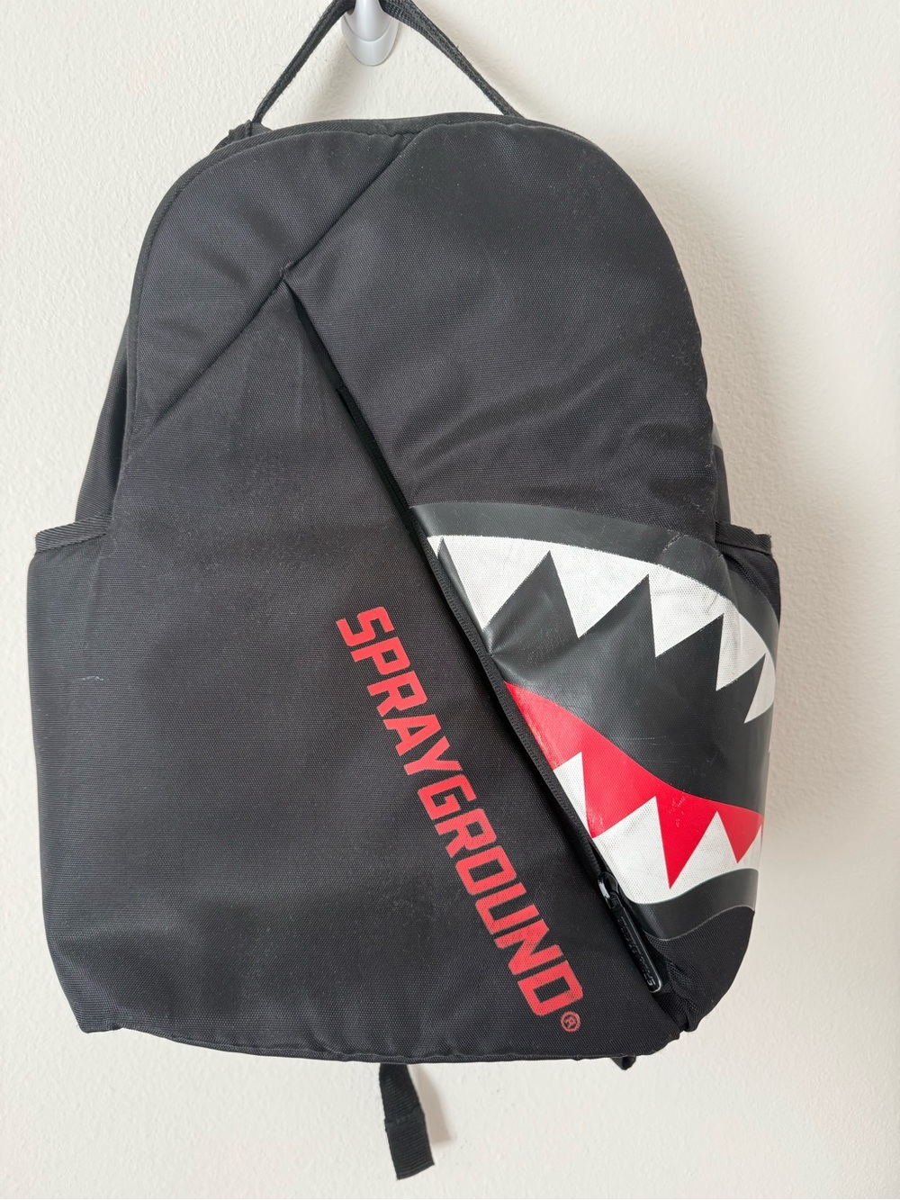 Sprayground Black Backpack with Red and White Shark-Mouth Graphic